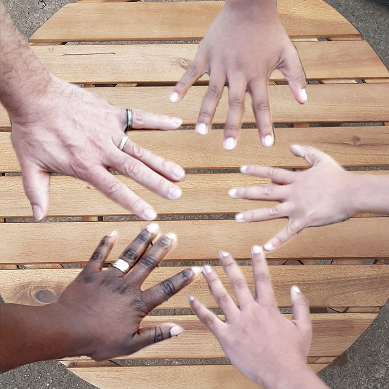 Ruth Wallis and her family showing their hands to represent family owned small business