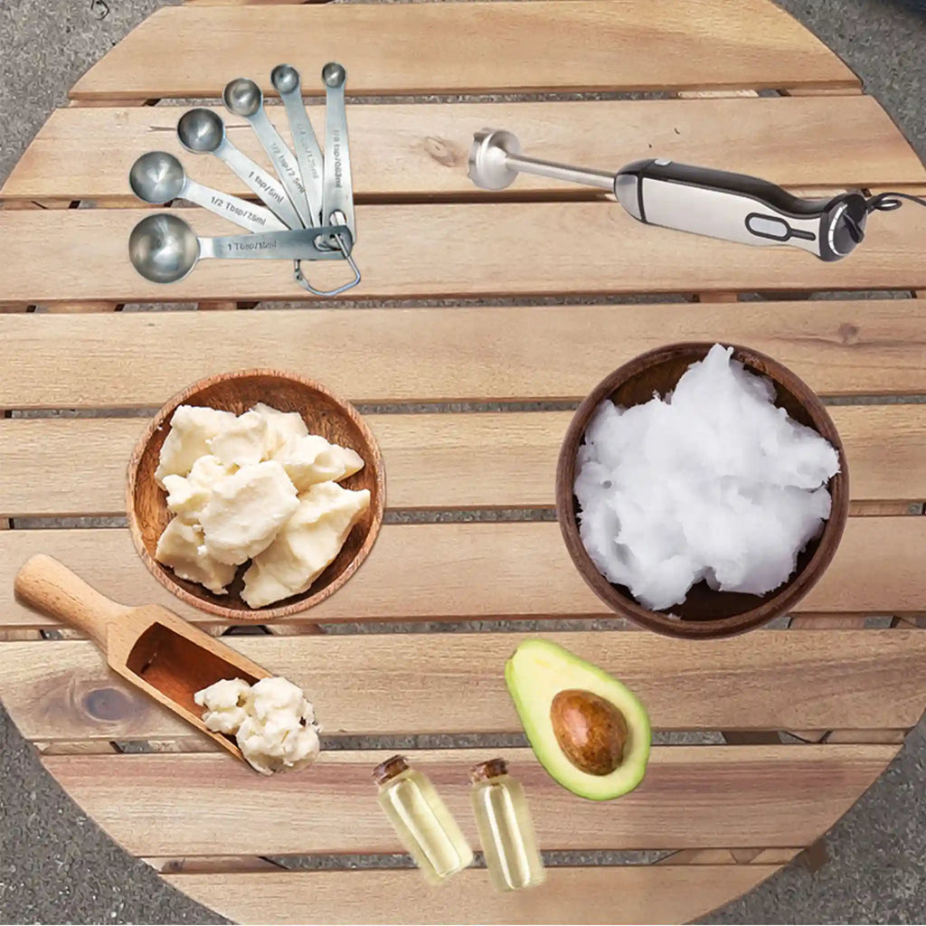 Close-up of raw shea butter, coconut oil, and artisinal mixing tools on a wooden table to represent the See My Curls handmade process. 